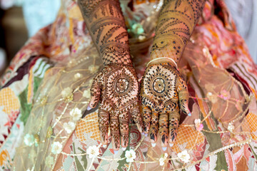 Intricate henna designs adorn hands, a beautiful display of cultural artistry