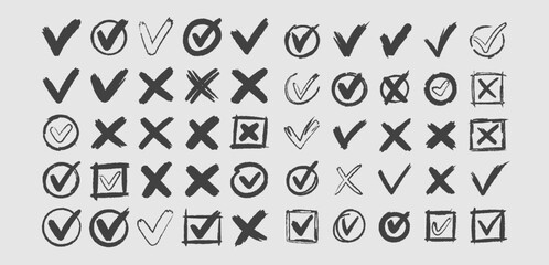 Collection of hand drawn check mark and cross mark symbols isolated on white background