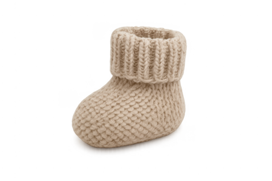 Knitted baby bootie keeping small feet warm, transparent background