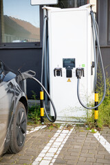 A man at a gas station takes disposable plastic gloves before refueling his car, showing attention to cleanliness, hygiene, and preparation for safe handling of fuel