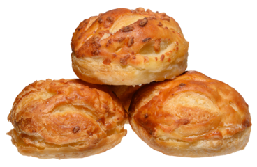 Stack of baked round filled puff pastry buns on isolated background