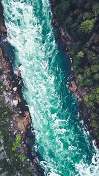Bird&rsquo;s-eye panorama of Niagara Falls river highlighting flowing water, rapids, and iconic landmark