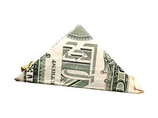 A dollar bill folded into a triangle on a white background.