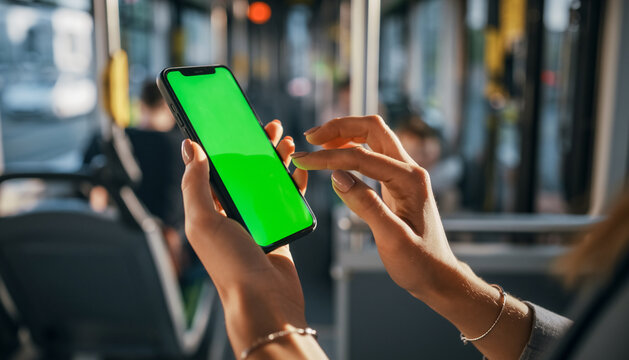 Hands woman hold use green screen phone sitting in bus touch telephone public communication vertical smartphone adult finger chroma urban cellphone application digital scrolling