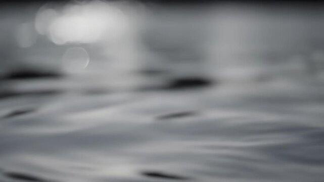 Elegant water splash creating ripples in monochrome, a moment of dynamic simplicity and serenity for mindful meditation or calming visual impact