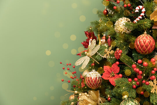 A Christmas tree decorated with ornaments, baubles, and flowers against a festive background. Space for text. Postcard - Powered by Adobe