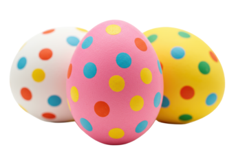Three vibrant pink, yellow, white Easter eggs with multicolored polka dots, pink forward, on transparent background, copy space, subtle shadows, festive Easter holiday atmosphere