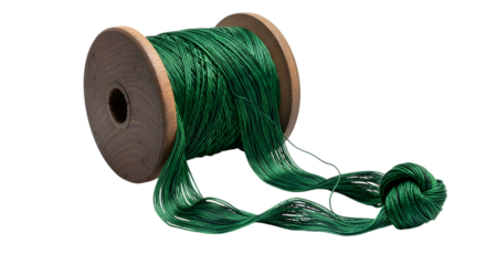 Spool of green thread isolated on transparent background for crafts