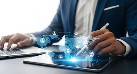 A person in a suit using a laptop and tablet with a digital world map overlay and social connections