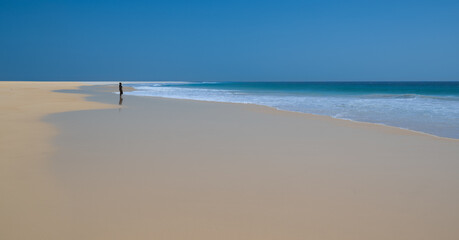 Boa Vista, Cape Verde - November 6, 2025 : African woman facing the waves on Santa Monica beach, Boa Vista