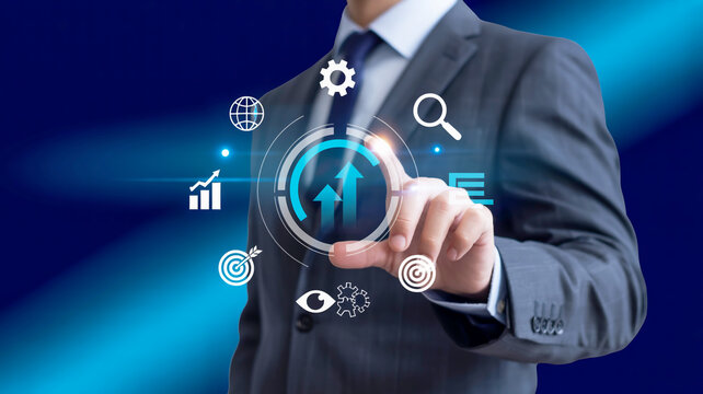 Businessman pointing at a digital interface with icons representing business strategy and growth image