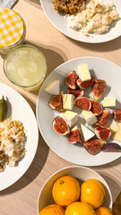 Zesty brunch tableau with creamy fig medley, citrus sunburst, Ukrainian Spyasennia vibes, and eclectic Litha festiveness in abundance