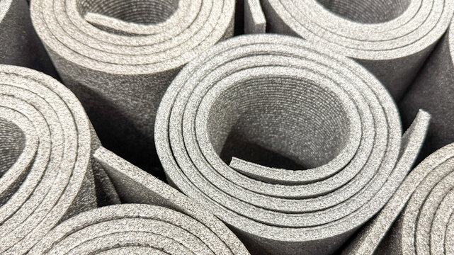 Coiled silver foam mats, textured spirals evoke tranquility, perfect for Tai Chi practice or National Relaxation Day serenity