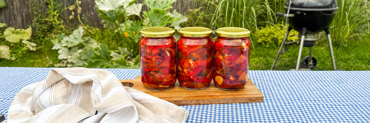 Jars of vibrant pickled vegetables whisper harvest tales on gingham cloth, evoking Slavic Maramasmas nostalgia and garden picnics