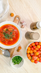 Vibrant borscht swirls beside a kaleidoscope of cherry tomatoes, capturing Yuletide warmth and Harvest Moon festivities