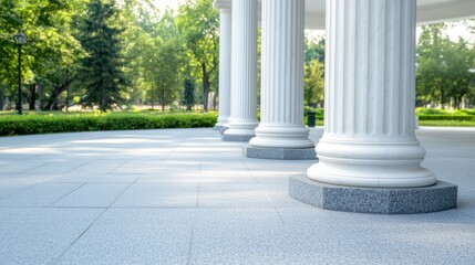 Naklejka premium Majestic white columns support an elegant canopy in a peaceful park with lush greenery during a sunny day