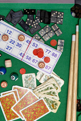 Collection of classic board games, scattered haphazardly on table, perfect for game nights and leisure time. Top view