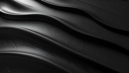 Smooth black embossed surface with subtle shadows, elegant tactile design