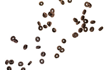 Chocolate rings cereal spill out into a bowl. Breakfast.