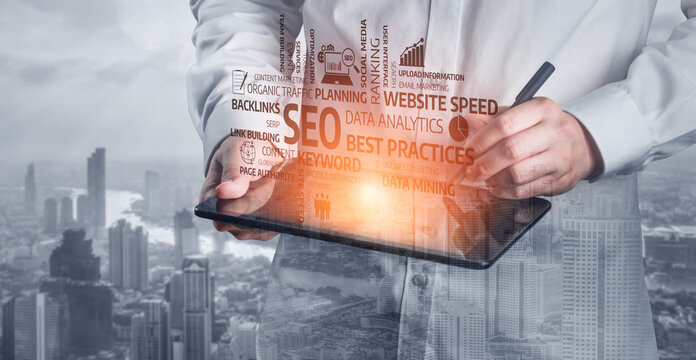 A professional in a white coat uses a digital tablet to jot down notes while urban skyline and business graphics blend in the background, highlighting data-driven technology. Tessel