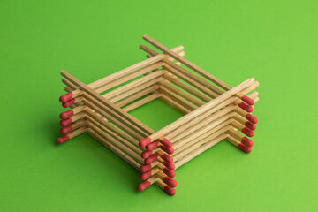large matches on a green background