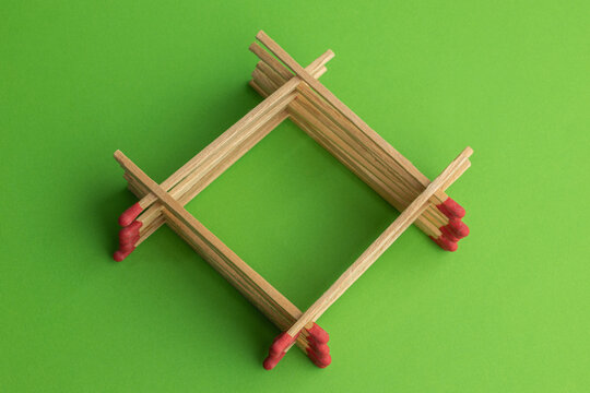 large matches on a green background