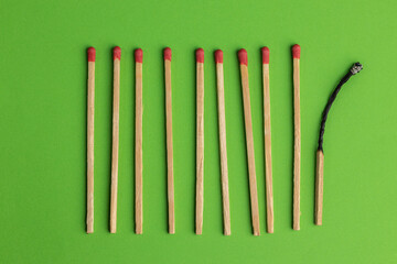 large matches on a green background