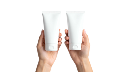 Two hands hold upright, identical white tubes with caps against a black backdrop