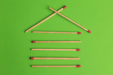 large matches on a green background