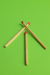 large matches on a green background