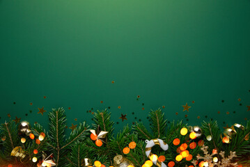 Christmas background with xmas tree, Christmas golden decoration and sparkle bokeh lights on green...
