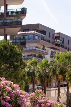 Modern sustainable architecture housing residential settings in Montpellier France with vegetation integrated into urban building materials and clean exterior layouts