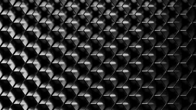 Black shiny metal cubes rotate in a smooth looping animation, reflecting light across their polished surfaces. The motion is minimal, modern, and atmospheric, creating a sleek high-tech background ide