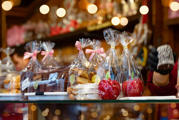 Sweet Christmas. Christmas caramelized apples. Sweets at the Christmas market. Postcard. Congratulation. Showcase of the Christmas market. Postcard. Congratulation. New Year 2026

