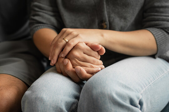 Supportive couple holding hands showing comfort and emotional connection