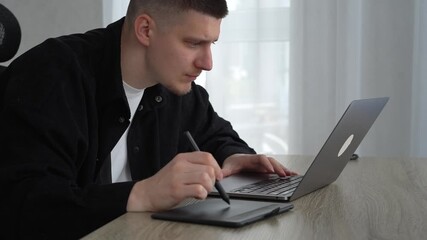 An office worker works on a laptop and uses a digital graphics tablet.
Digital artist or logo illustrator for brands and businesses.
Business, illustration, stylus, business, drawing, art