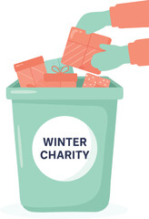 Hands place wrapped gifts into a pastel green “Winter Charity” donation bin decorated with a seasonal theme
