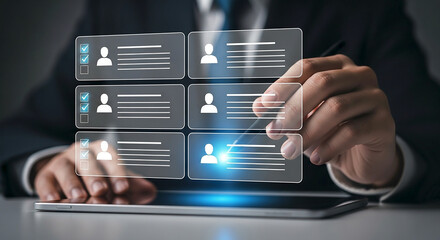 Man selecting virtual profiles on a tablet with a pen for recruitment and human resources process