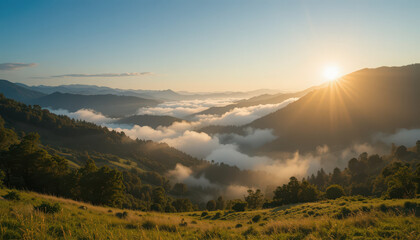 Mountain range with fog and sunlit grassy foreground