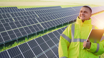 Engineer inspecting solar panels on for clean energy
