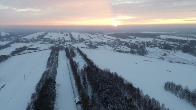 Aerial drone shot of snowy rural valley