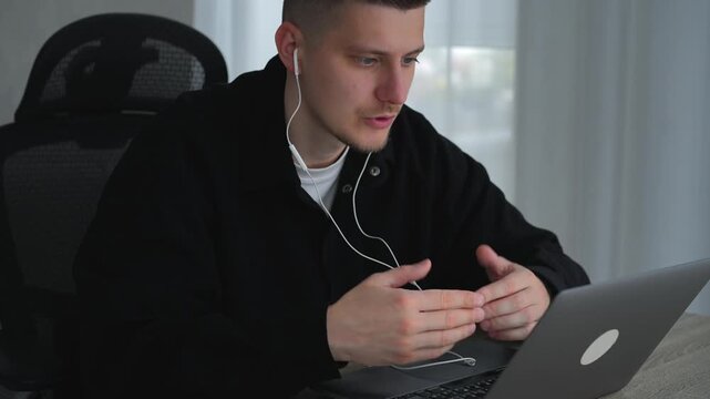 A service center employee communicates with colleagues during an online conference call.
Remote work at a computer.
A call center operator sits at a desk in an office, communicating with clients remot