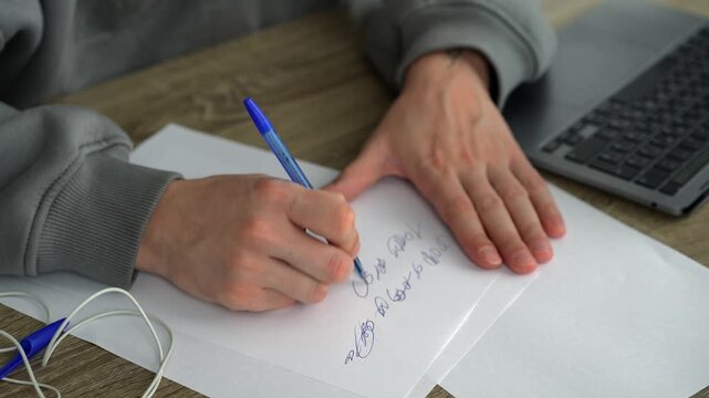 Writing a script at a desk in an office.
A man writes with a pen on a white sheet of paper.
A copy editor writes with a pen in an office.
A man writes a text on paper.
Text, script, documents, editor,