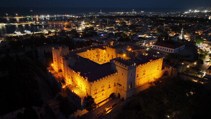 Obraz premium Aerial drone night shot of iconic Palace of the Grand Master in old town of Rhodes island, Dodecanese, Greece