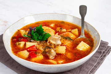 Souzi soup. Georgian dish, meat with oats, tomato sauce and herbs,