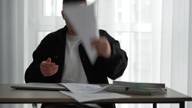Business problems.
A sad businessman scatters documents and sits at his desk in a dejected mood.
Sadness and problems.
Company bankruptcy and an angry manager in the office.