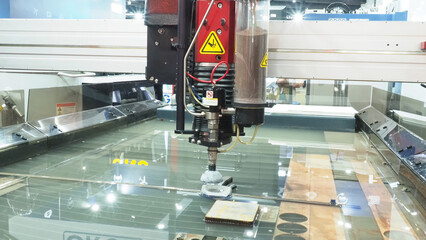 a high precision industrial waterjet cutting machine in operation