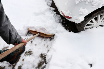 Man is removing snow after the snowfall.