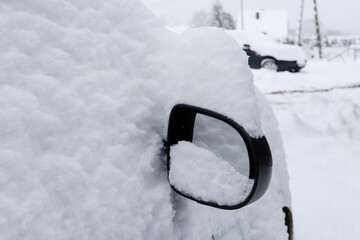 Wing mirror under the snow.