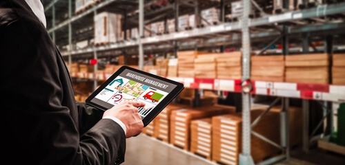 Naklejka premium Warehouse management innovative software in computer for real time monitoring of goods package delivery . Computer screen showing smart inventory dashboard for storage and supply chain distribution .